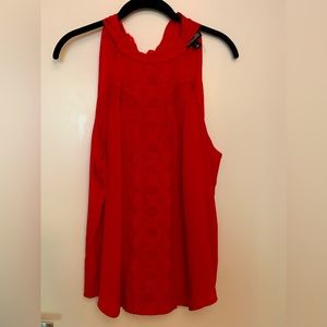 Sleeveless red blouse